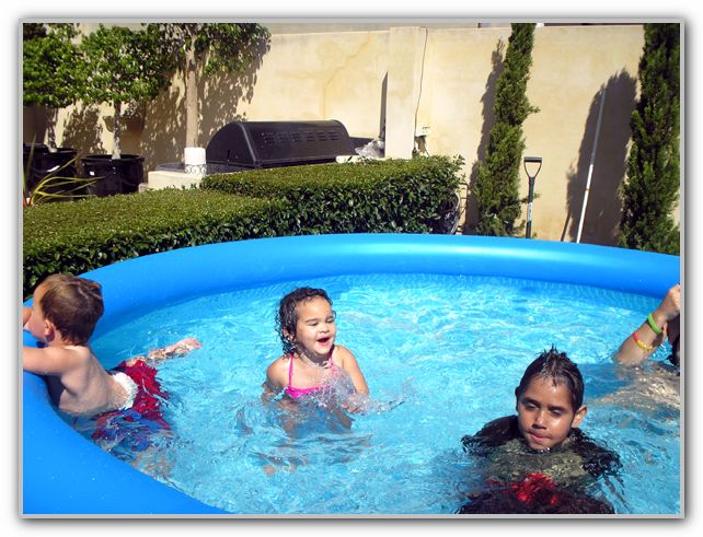 Ebony with friends Jack & Charlie in wading pool DJ and SJ house Xmas Day 2006
